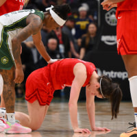 Jun 24, 2025; Seattle, Washington, USA; Seattle Storm guard Erica Wheeler (17) checks on Indiana Fever guard Caitlin Clark (22) during the second half at Climate Pledge Arena. Mandatory Credit: Steven Bisig-Imagn Images
