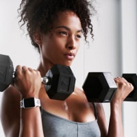 Woman lifting weights.