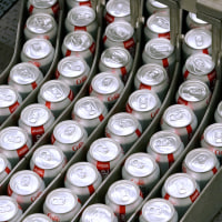 Cans of Coca-Cola Co. Diet Coke brand soda move along a conveyor belt at the Swire Coca-Cola bottling plant in West Valley City, Utah, U.S., on Friday, April 19, 2019. 