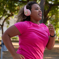 Latin woman running in city