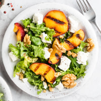 Summer salad with grilled peaches and feta cheese.