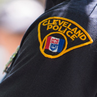 Image:  A Cleveland police officer surveys a street on May 23, 2015 in Cleveland, Ohio.
