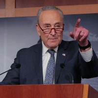 Senate Minority Leader Charles Schumer talks to reporters on July 1, 2025.