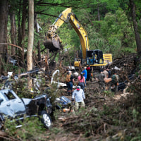 First responders carry out search and rescue operations