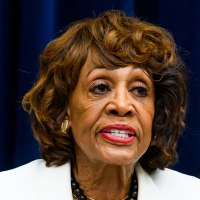 Maxine Waters points as she speaks. 