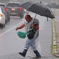 Heavy rain during morning commute floods I-93, temporarily closes part of Red Line, and prompts flash flood warnings