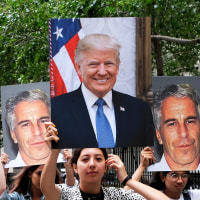 A group of young protesters holds pictures of Jeffrey Epstein and Donald Trump.