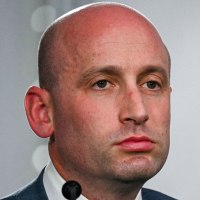 A split composite of Stephen Miller and Kristi Noem.