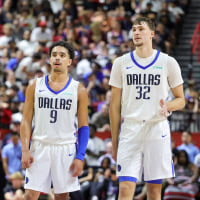LAS VEGAS, NEVADA - JULY 10: Ryan Nembhard #9 and Cooper Flagg #32 of the Dallas Mavericks talk during a break in the second half of a 2025 NBA Summer League game against the Los Angeles Lakers at the Thomas & Mack Center on July 10, 2025 in Las Vegas, Nevada. NOTE TO USER: User expressly acknowledges and agrees that, by downloading and or using this photograph, User is consenting to the terms and conditions of the Getty Images License Agreement. (Photo by Ethan Miller/Getty Images)