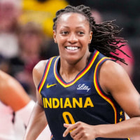 Indiana Fever guard Kelsey Mitchell (0) smiles after a play Thursday, July 3, 2025, during a game between the Indiana Fever and the Las Vegas Aces at Gainbridge Fieldhouse in Indianapolis.