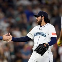 Jul 5, 2025; Seattle, Washington, USA; Seattle Mariners catcher Cal Raleigh (29) greets pitcher Andrés Muñoz (75) after the final out against the Pittsburgh Pirates at T-Mobile Park. Mandatory Credit: John Froschauer-Imagn Images