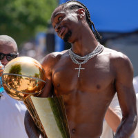 Oklahoma City Thunder guard Shai Gilgeous-Alexander carries the Larry O'Brien trophy as he celebrates with fans as the  Oklahoma City Thunder celebrate their first NBA Finals title win with a champions parade throughout downtown Oklahoma City on Tuesday, June 24, 2025.  Mandatory Credit: Bryan Terry/USA TODAY NETWORK via Imagn Images