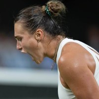 Jul 4, 2025; Wimbledon, United Kingdom; Aryna Sabalenka reacts to a point during her match against Emma Raducanu of Great Britain on day five at the All England Lawn Tennis and Croquet Club. Mandatory Credit: Susan Mullane-Imagn Images