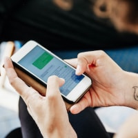 Close Up Of Woman Messaging Friends