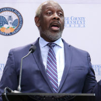 Jerry Demings holds up a copy of the letter