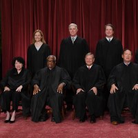 Justices of the Supreme Court pose for their official photo at the Supreme Court in Washington, DC.