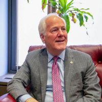 Kash Patel and John Cornyn.