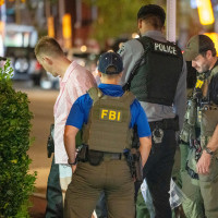 FBI and Border Patrol officers arrest a man