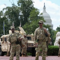Members of the National Guard stand outside Union Station on Aug. 14, 2025 in Washington, D.C. 