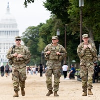Members of the National Guard patrol near the Capitol