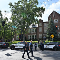 Police and first responders work at the scene of a shooting near Annunciation Church and Catholic School in Minneapolis, Minneosta, on August 27, 2025. 
