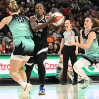 Aug 13, 2025; Las Vegas, Nevada, USA; Las Vegas Aces guard Jewell Loyd (24) collides with New York Liberty forward Leonie Fiebich (13) during the second quarter of their game at Michelob Ultra Arena. Mandatory Credit: Candice Ward-Imagn Images