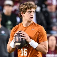 Nov 30, 2024; College Station, Texas, USA; Texas Longhorns quarterback Arch Manning warms up prior to the game against the Texas A&amp;M Aggies. The Longhorns defeated the Aggies 17-7 at Kyle Field. Mandatory Credit: Maria Lysaker-Imagn Images