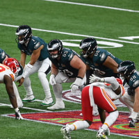 Eagles players and Kansas City Chiefs players lined up against each other on the field