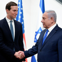 Benjamin Netanyahu, right, shakes hands with advisor Jared Kushner