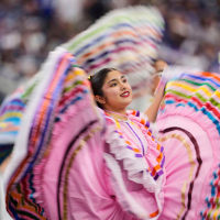 Dancers perform at an NFL halftime for Hispanic Heritage Month Sunday, Sept. 14, 2025, in Arlington, Texas. 