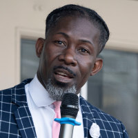 Ian Andre Roberts speaking at a rally.