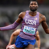 TOKYO, JAPAN - SEPTEMBER 16: Cordell Tinch of Team United States celebrates after qualifying for the Final during the Men's 110 Metres Hurdles Semi-Finals on day four of the World Athletics Championships Tokyo 2025 at National Stadium on September 16, 2025 in Tokyo, Japan.  (Photo by Hannah Peters/Getty Images)