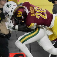 Green Bay Packers wide receiver Jayden Reed (11) is injured while being tackled by Washington Commanders safety Quan Martin (20) during the first quarter of their game Thursday, September 11, 2025 at Lambeau Field in Green Bay, Wisconsin.