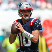 Sep 14, 2025; Miami Gardens, Florida, USA; New England Patriots quarterback Drake Maye (10) looks to pass against the Miami Dolphins in the second quarter at Hard Rock Stadium. Mandatory Credit: Nathan Ray Seebeck-Imagn Images