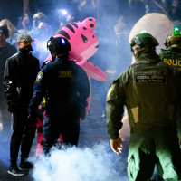 Anti-I.C.E. protesters clash with federal agents at the U.S. Immigration and Customs Enforcement building.