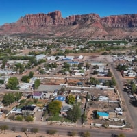 An aerial view of mountain tops and homes