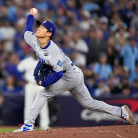 Los Angeles Dodgers pitcher Yoshinobu Yamamoto throws against the Toronto Blue Jays during the eighth inning in Game 2 of baseball's World Series.