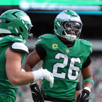 Oct 26, 2025; Philadelphia, Pennsylvania, USA; Philadelphia Eagles tight end Dallas Goedert (88) celebrates scoring a touchdown with running back Saquon Barkley (26) in the second quarter against the New York Giants at Lincoln Financial Field. Mandatory Credit: Bill Streicher-Imagn Images
