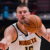 Oct 6, 2025; Vancouver, British Columbia, CAN; Denver Nuggets center Nikola Jokic (15) makes a pass against the Toronto Raptors in the second half at Rogers Arena. Mandatory Credit: Bob Frid-Imagn Images
