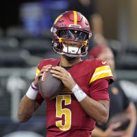 ARLINGTON, TEXAS - OCTOBER 19: Jayden Daniels #5 of the Washington Commanders participates in warmups prior to a game against the Dallas Cowboys at AT&T Stadium on October 19, 2025 in Arlington, Texas. (Photo by Stacy Revere/Getty Images)