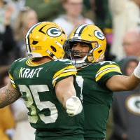 GREEN BAY, WISCONSIN - OCTOBER 12: Tucker Kraft #85 of the Green Bay Packers celebrates after his touchdown reception against the Cincinnati Bengals with Jordan Love #10 during the fourth quarter in the game at Lambeau Field on October 12, 2025 in Green Bay, Wisconsin. (Photo by Michael Reaves/Getty Images)