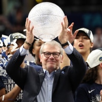 Apr 6, 2025; Tampa, FL, USA; Connecticut Huskies head coach Geno Auriemma holds up the WBCA CoachesÕ trophy after the national championship of the women's 2025 NCAA tournament against the South Carolina Gamecocks at Amalie Arena. Mandatory Credit: Nathan Ray Seebeck-Imagn Images