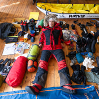 Explorer Colin O’Brady is surrounded by bags of gear for his upcoming expedition.