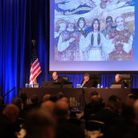 Rev. Michael J.K. Fuller, Archbishop Timothy Broglio and Archbishop William Lori of Baltimore conduct the United States Conference of Catholic Bishops plenary assembly in Baltimore, Md. on Tuesday. 