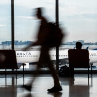 Passengers walk at the hall of San Francisco International Airport.