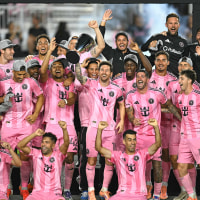 Inter Miami's Argentine forward 10 Lionel Messi celebrates with the trophy after his team's victory in the Major League Soccer Eastern Conference final match between Inter Miami and New York City FC at Chase Stadium in Fort Lauderdale, Florida on November 29, 2025. 