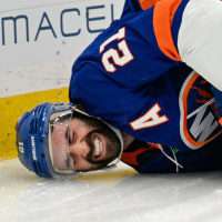 Nov 28, 2025; Elmont, New York, USA; New York Islanders center Kyle Palmieri (21) falls to the ice after an injury against the Philadelphia Flyers during the second period at UBS Arena. Mandatory Credit: Dennis Schneidler-Imagn Images