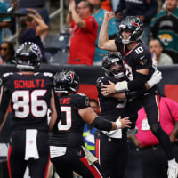 HOUSTON, TEXAS - NOVEMBER 09:  Davis Mills #10 of the Houston Texans is congratulated by his teammates after running the ball for a touchdown against the Jacksonville Jaguars during the second half in the game at NRG Stadium on November 09, 2025 in Houston, Texas. (Photo by Tim Warner/Getty Images)