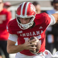 Indiana's Fernando Mendoza (15) runs during the Indiana versus Wiscsonsin football game at Memorial Stadium on Saturday, Nov. 15, 2025.