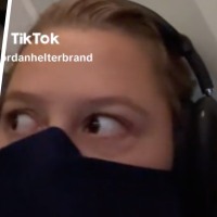 A woman on a plane in a jam — perhaps even a jammy egg.